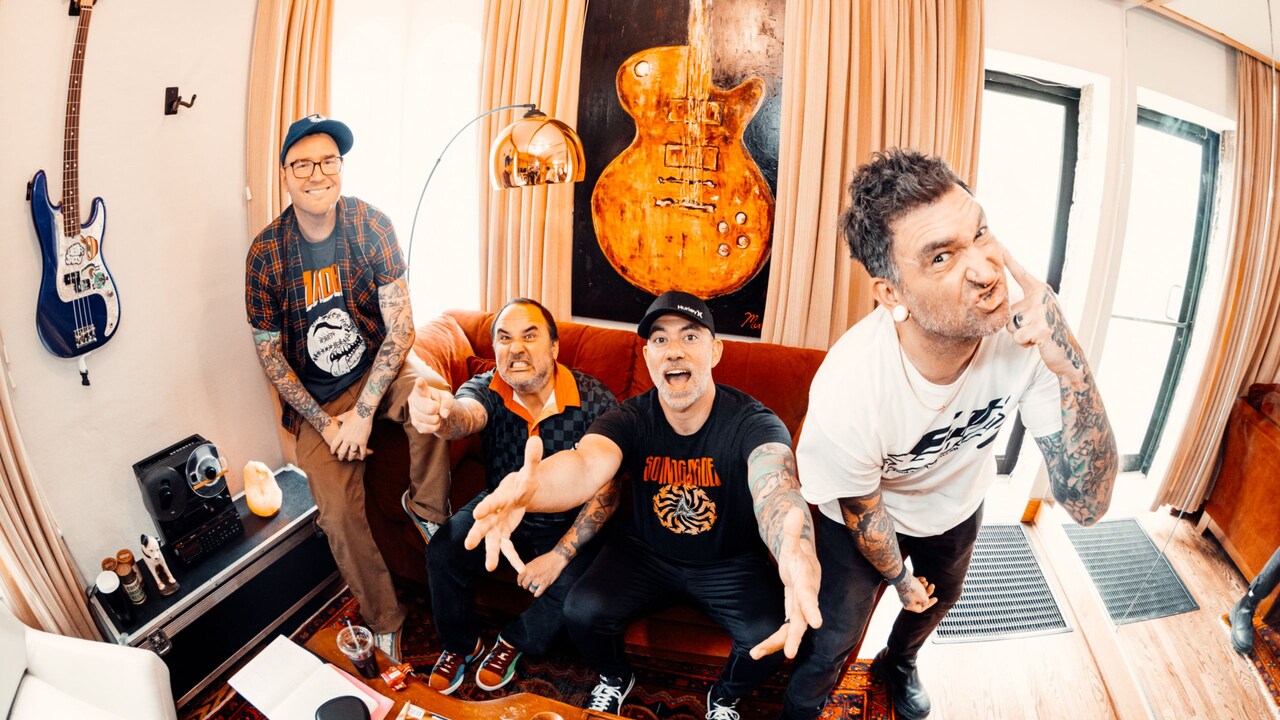 A portrait of 4 musicians from the band New Found Glory