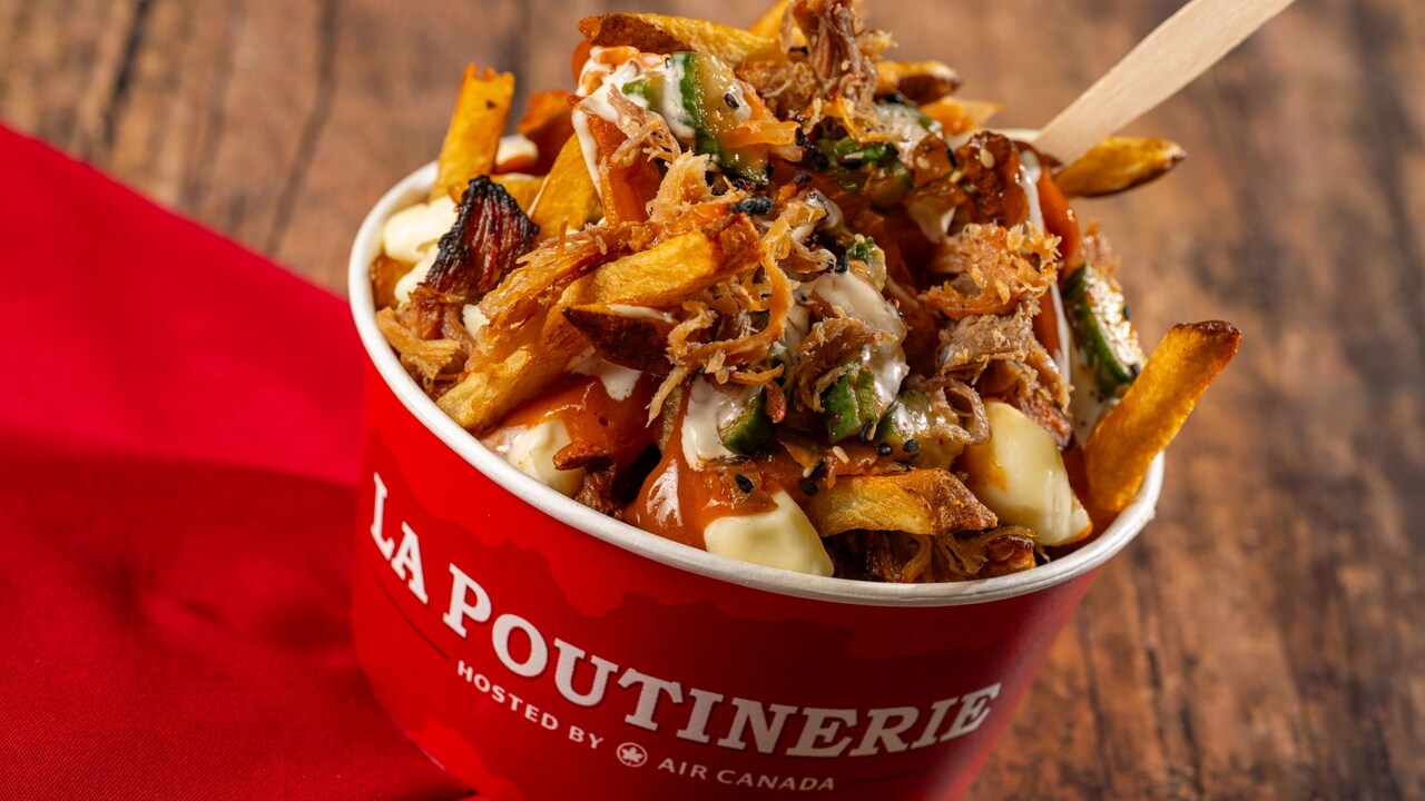 French Fries with cheese curds, smoked meat, pickles and mustard gravy