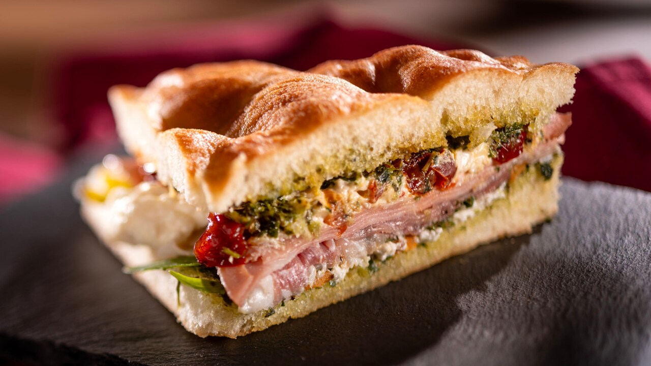 Schiacciata Sandwich on focaccia bread, with mortadella, prosciutto ham and sun dried peppers