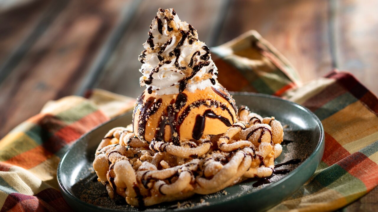 Pumpkin Pie Funnel Cake, with pumpkin pie ice cream, whipped cream, chocolate sauce and streusel
