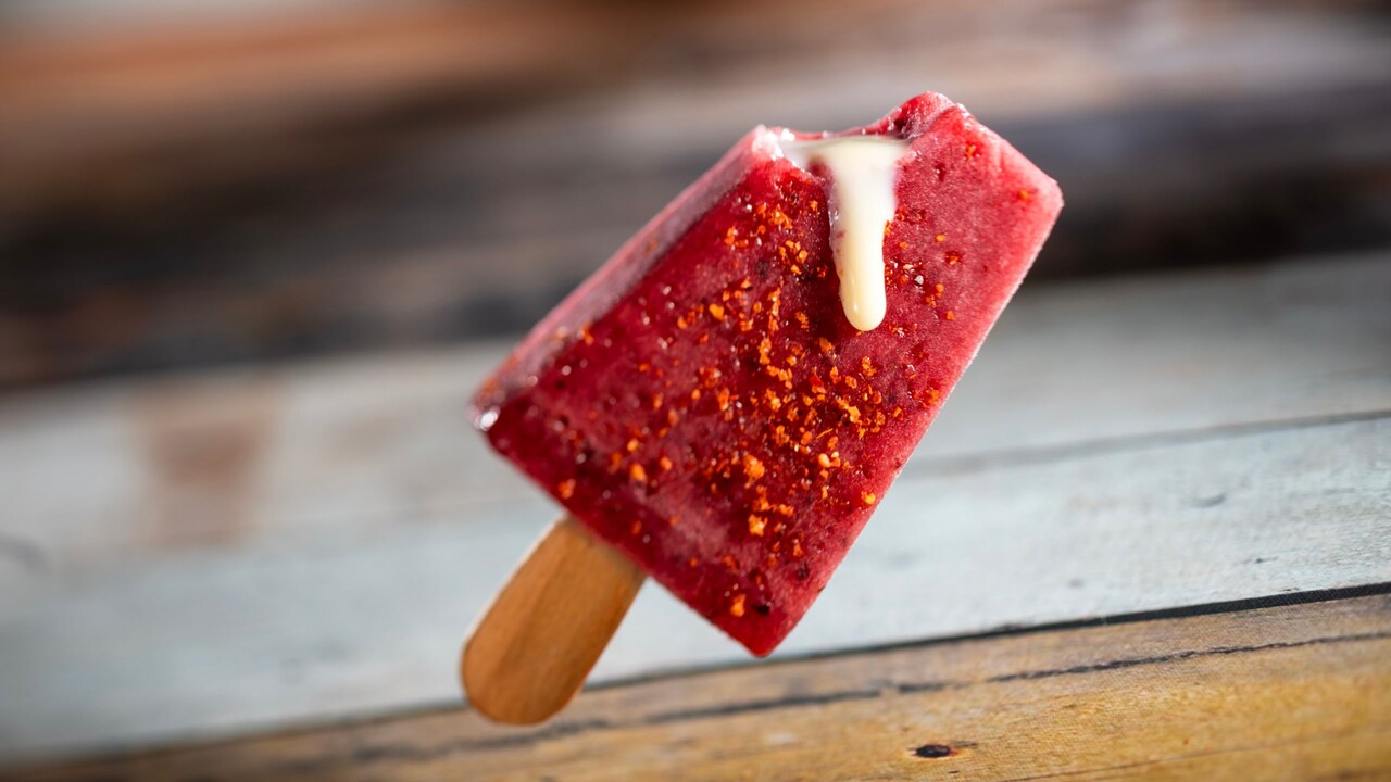 Paleta de Moras, a berry ice pop with sweet condensed milk filling and chili lime seasoning
