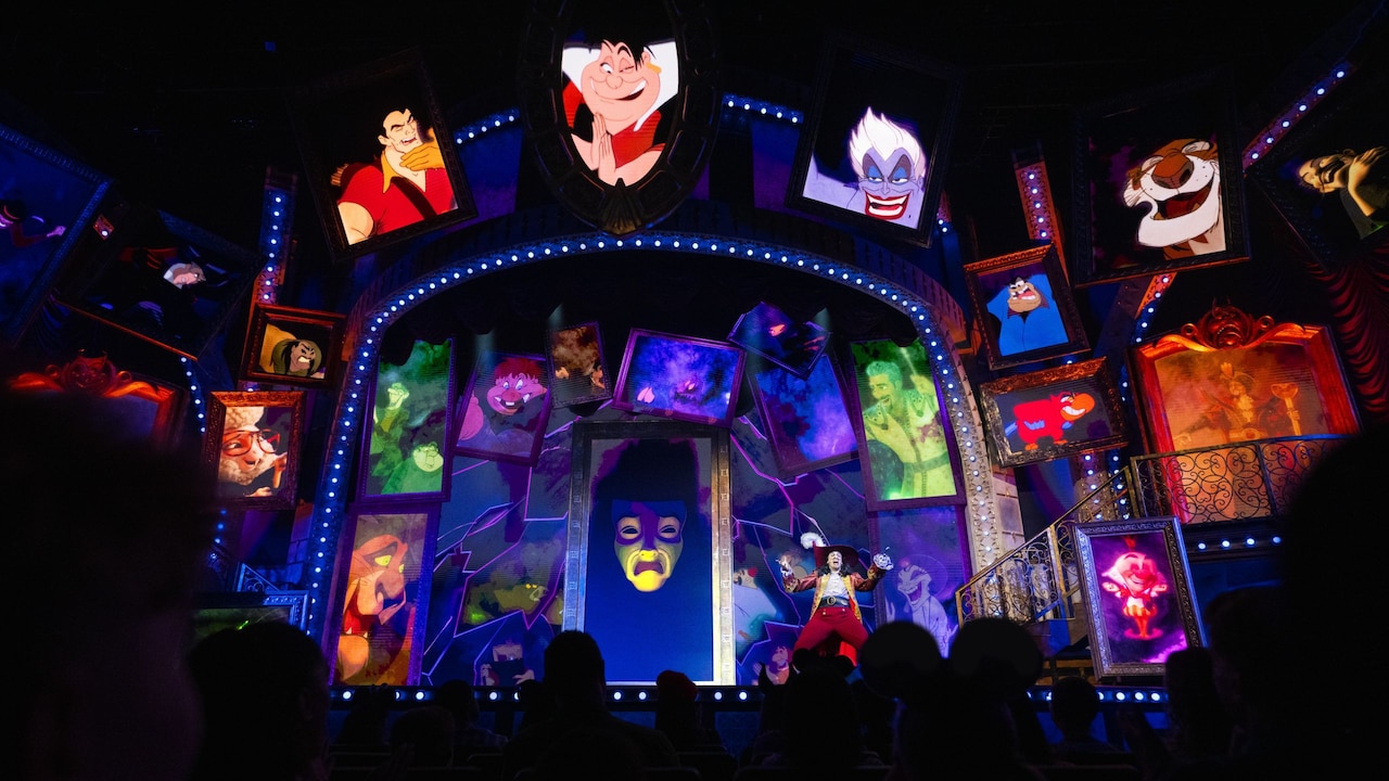 Captain Hook on stage with animated portraits of other Disney villains during Disney Villains, Unfairly Ever After at Disney’s Hollywood Studios