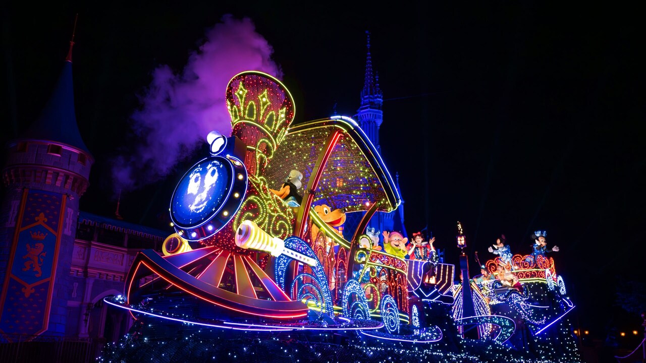 Disney Characters riding in illuminated floats in the Disney Starlight, Dream the Night Away parade at Magic Kingdom park