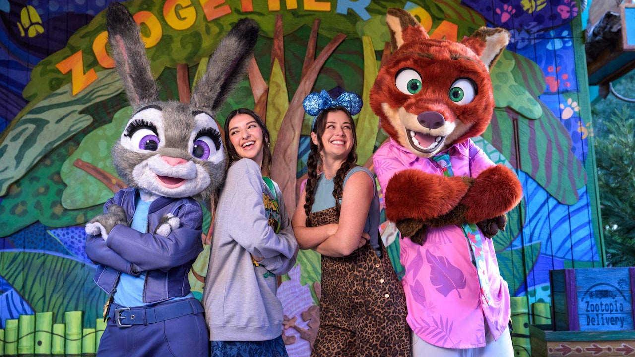 Two teenagers posing with Judy Hopps and Nick Wilde at Zootopia Better Zoogether!