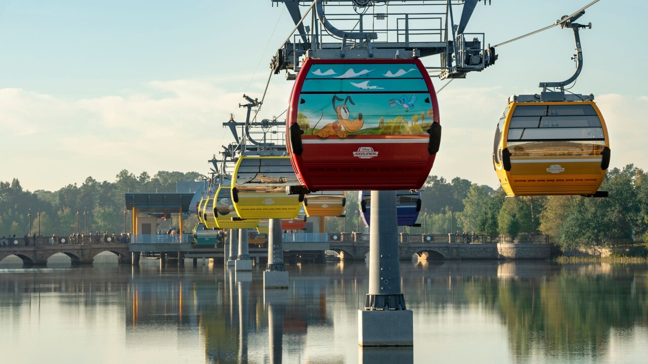 Aerial gondolas of Disney Skyliner above Hourglass Lake