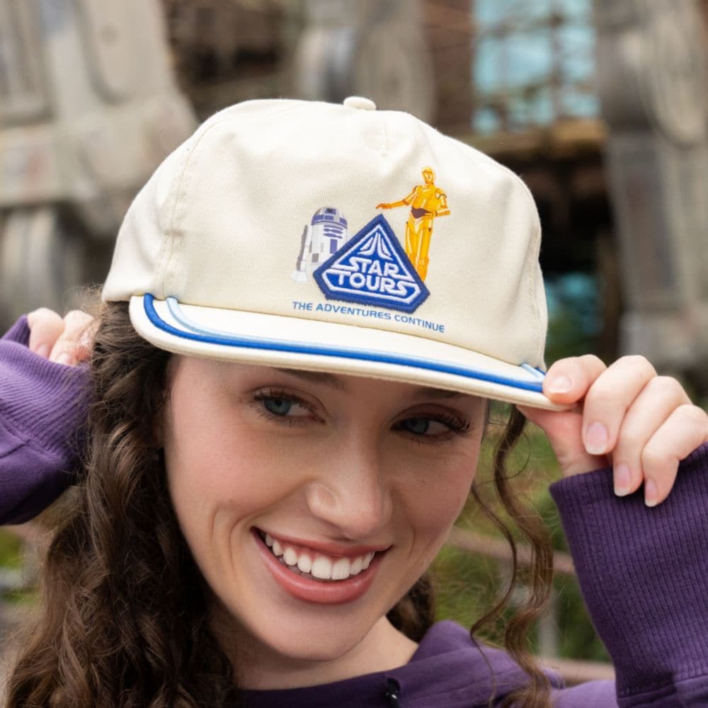A Guest wearing a Star Tours baseball cap