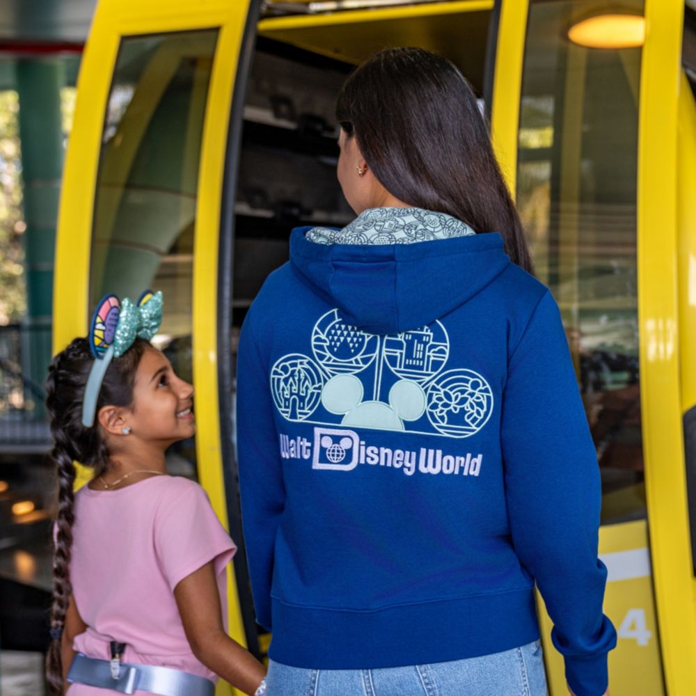 Guests wearing Walt Disney World Resort apparel as they board the Disney Skyliner