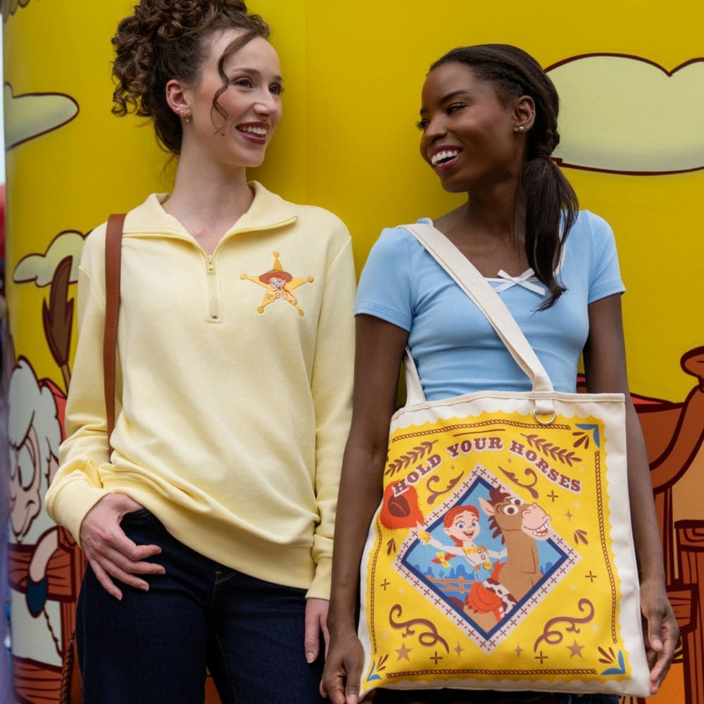 Two Guests wearing Toy Story merchandise at Disney's Hollywood Studios theme park