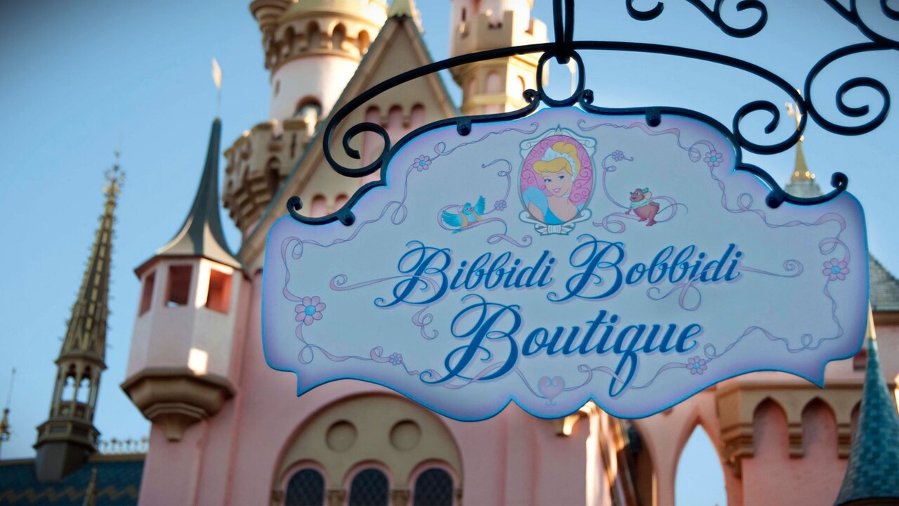 A shop sign for Bibbidi Bobbidi Boutique featuring Cinderella