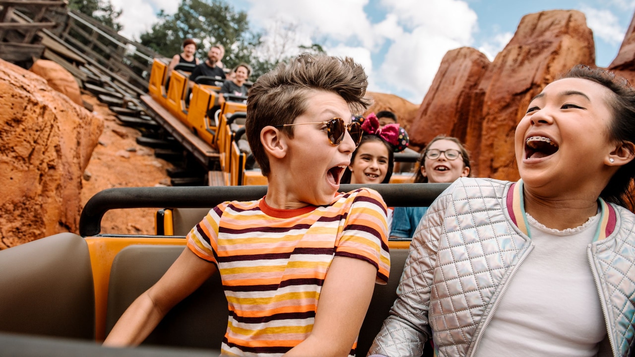 Two Guests laughing while riding Big Thunder Mountain Railroad at Magic Kingdom park 