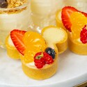 A pair of Mickey icon shaped fruit tarts