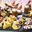 Several miniature desserts, including Key Lime Tart and Brownie Espresso Bar, lined up in rows