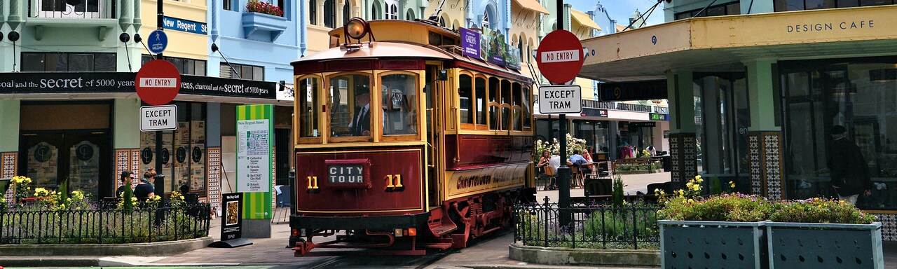 A trolley rides down the middle of Regent Street in Christchurch, New Zealand