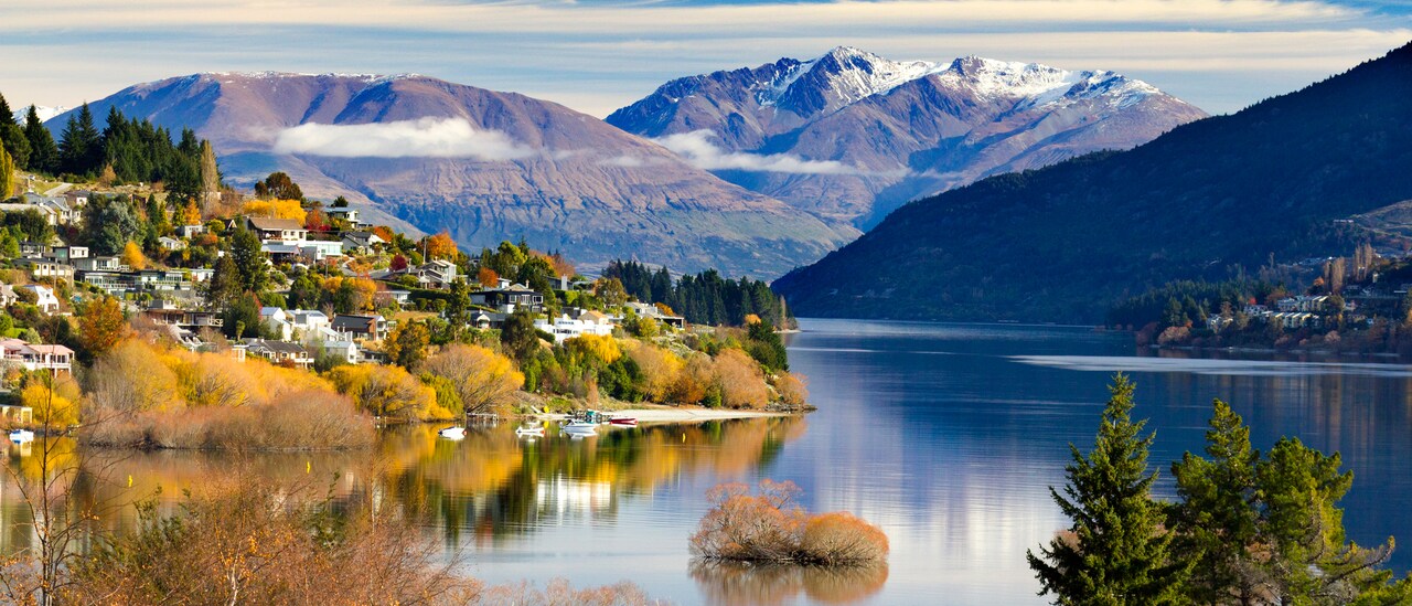 Lake Wakatipu flows past the city of Queenstown towards a distant mountain range