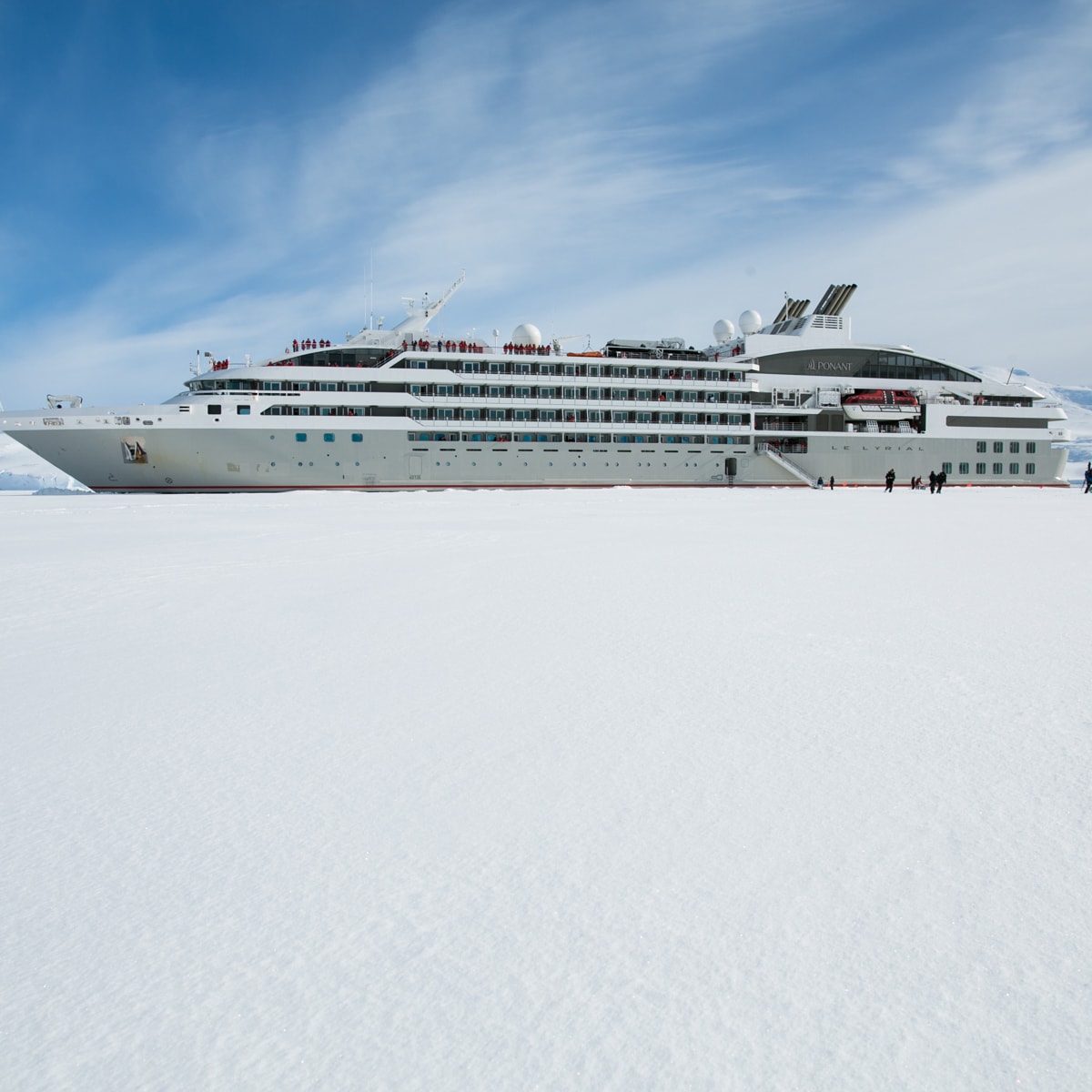 Cruise ship with disembarkation gangway to the snowy shore of Antarctica Cruise ship with disembarkation gangway to the snowy shore of Antarctica