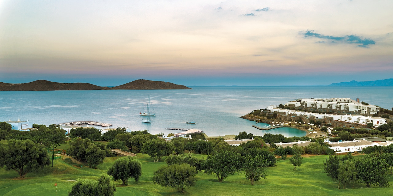 A lush, seaside golf course and resort on a beach in Crete