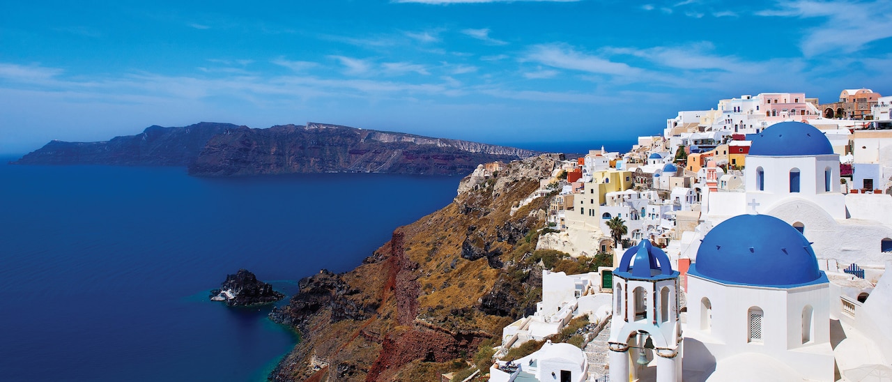 Bask in the tranquility and blue domes of Santorini
