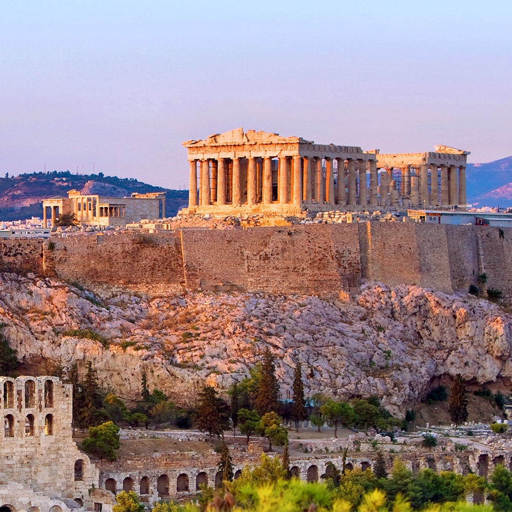 The Acropolis sits on a rocky plateau high above ancient ruins in Greece