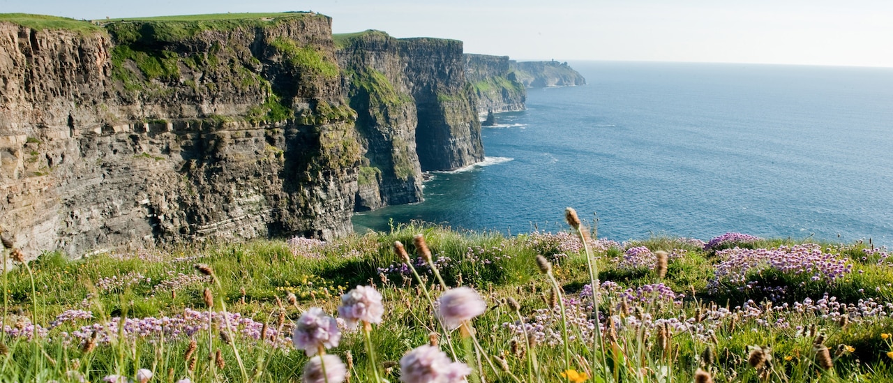 The Cliffs of Moher loom over the sea