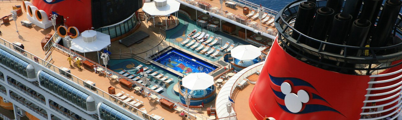 The upper deck and swimming pool of the Disney Magic Cruise Ship The upper deck and swimming pool of the Disney Magic Cruise Ship
