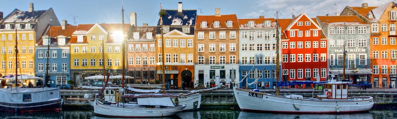 Several boats docked in Copenhagen's harbor Several boats docked in Copenhagen's harbor