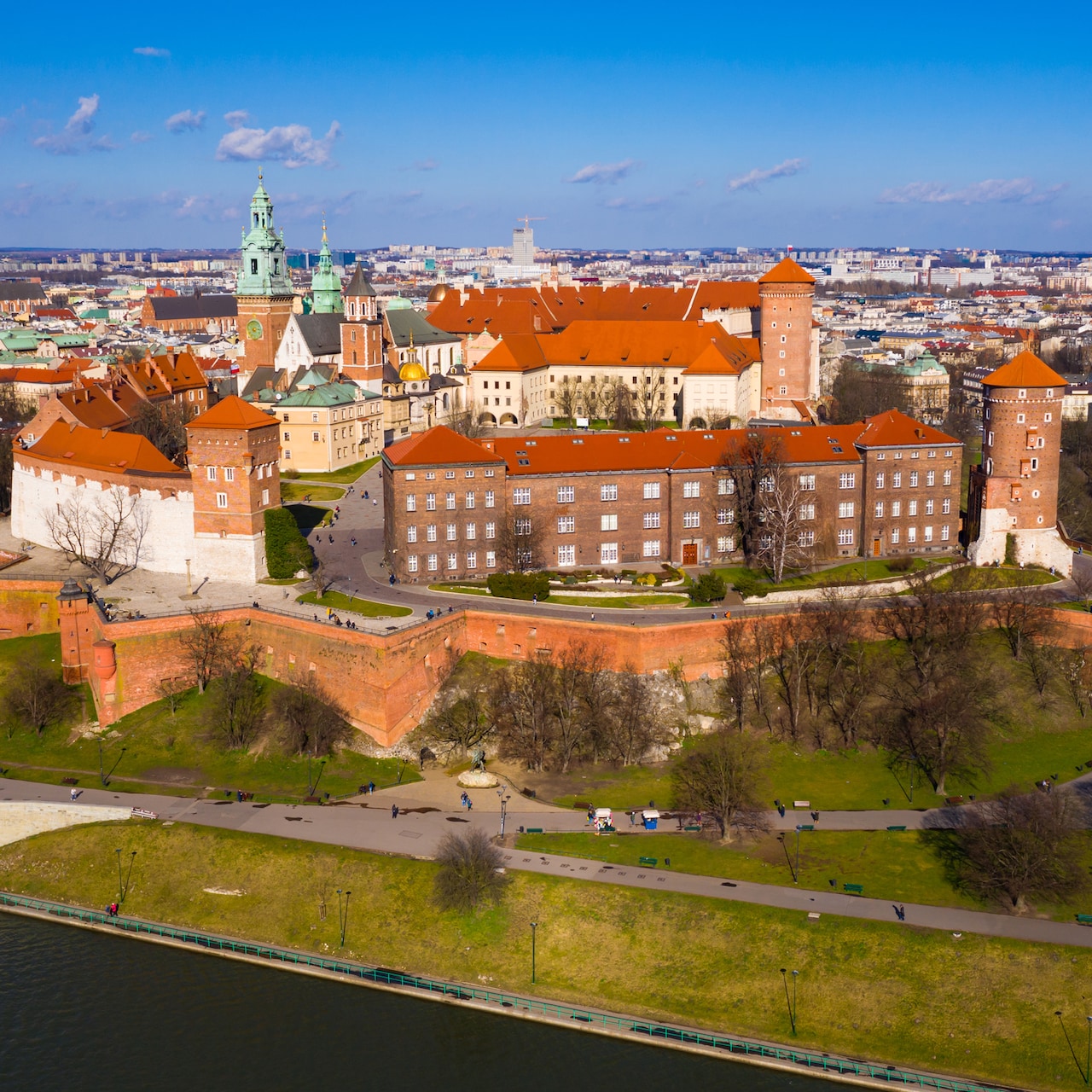 Wawel Castle on a hill, surrounded by the city of Krakow