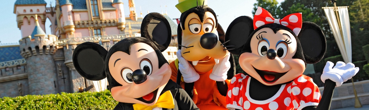 Mickey Mouse, Minnie Mouse and Goofy Characters outside Sleeping Beauty Castle at Disneyland Park