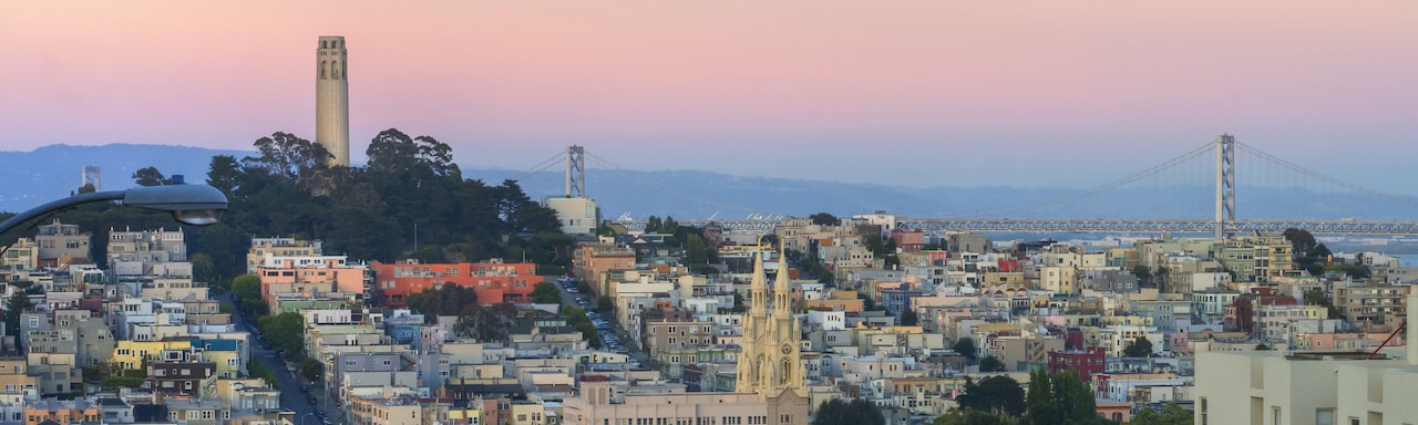 San Francisco at dusk, featuring the Coit Tower and Bay Bridge San Francisco at dusk, featuring the Coit Tower and Bay Bridge