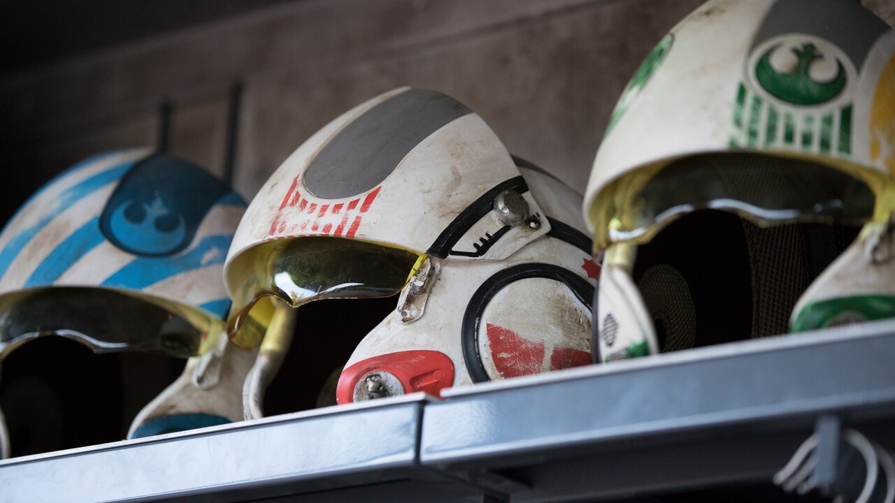 A shelf with Resistance pilot helmets.