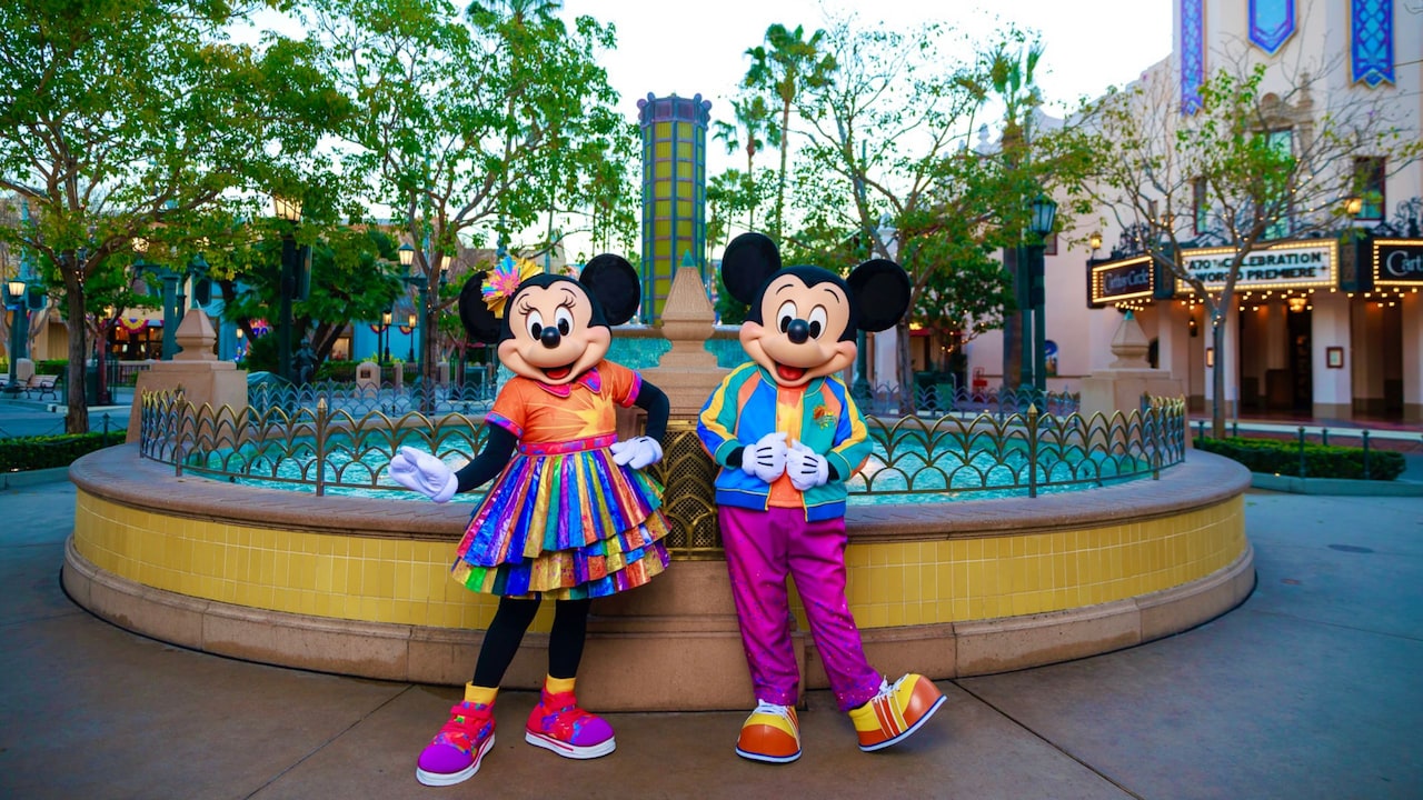 Minnie Mouse and Mickey Mouse wearing matching outfits for the 25th anniversary of Disney California Adventure Park