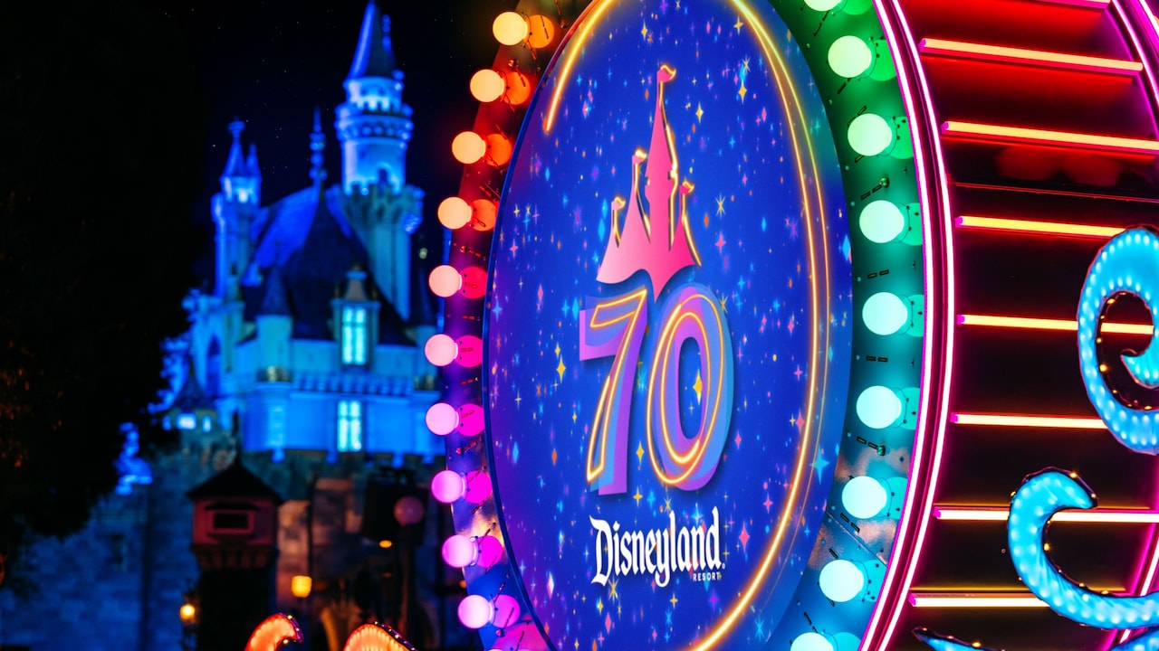 A glowing drum with the Disneyland Resort 70th Celebration logo during the Paint The Night parade