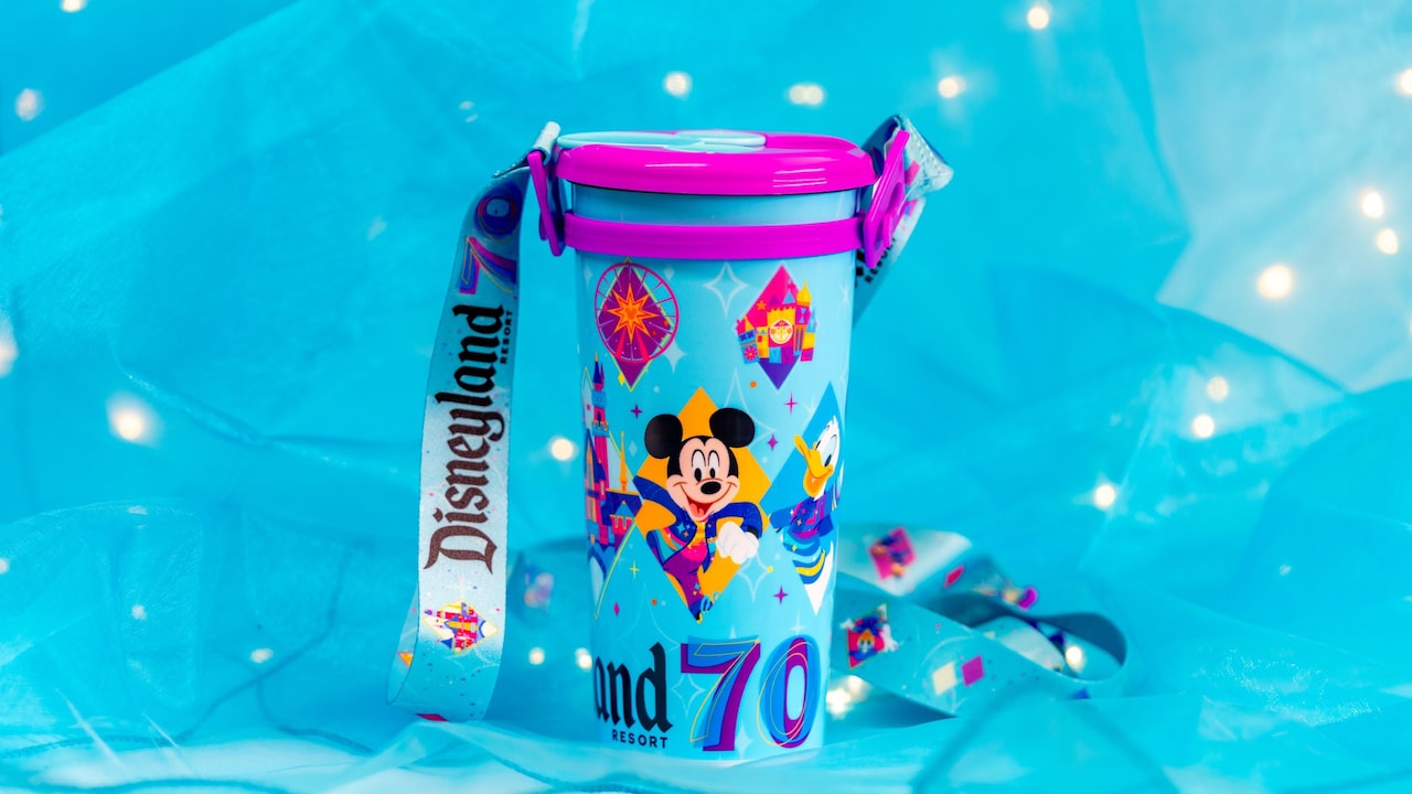 A Disneyland Resort 70th Celebration drink tumbler featuring Disney characters