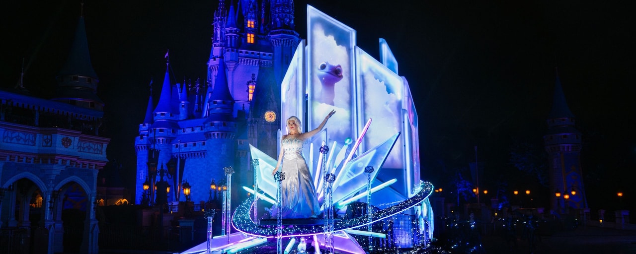 A scene from the Disney Starlight Dream the Night Away nighttime parade at Magic Kingdom park featuring Elsa from Disney’s Frozen 