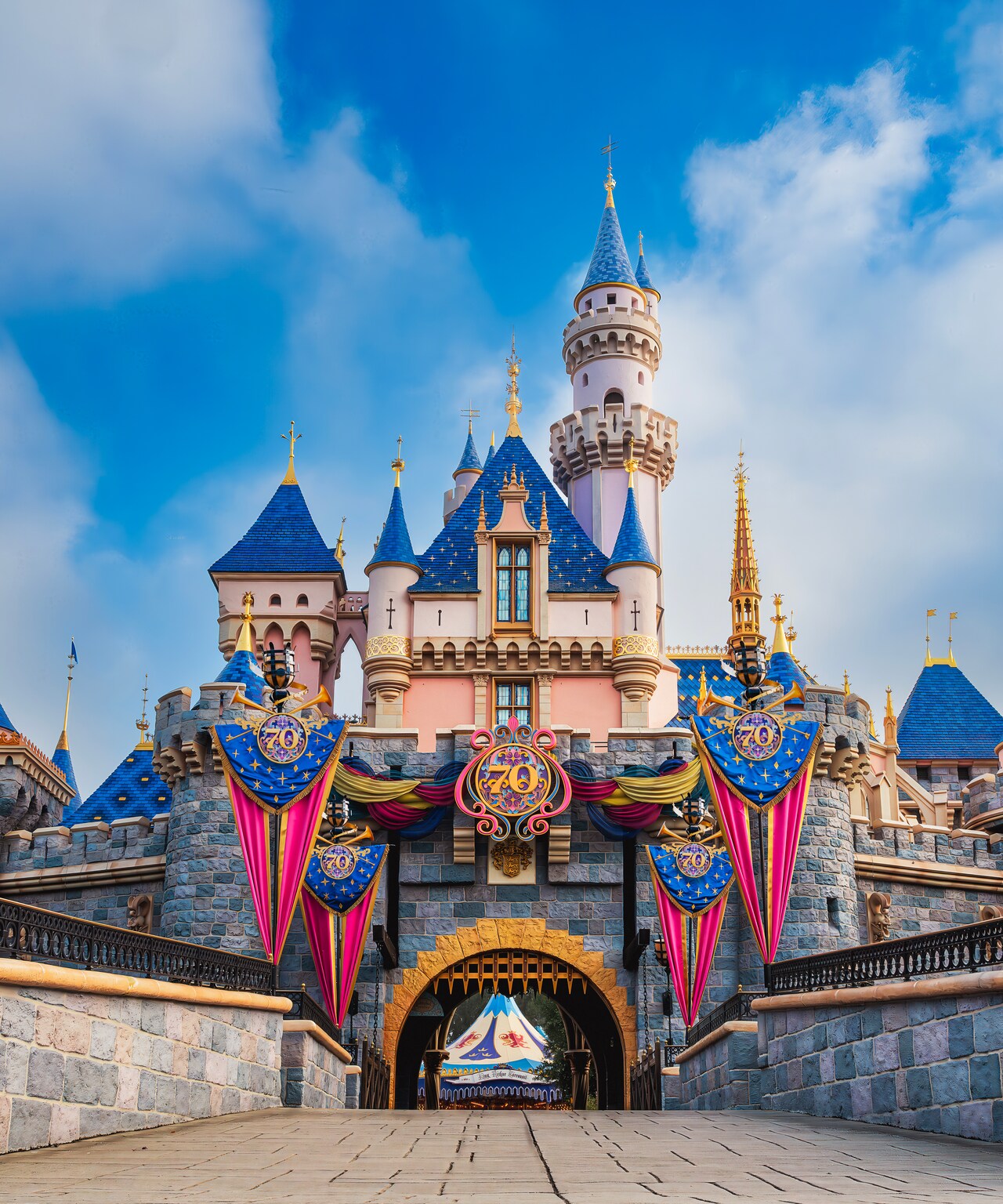 The Sleeping Beauty Castle at Disneyland Park with 70th Anniversary decorations