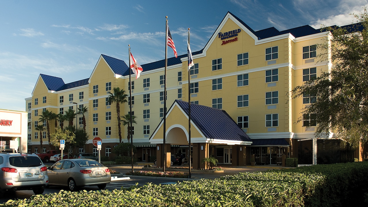 The exterior of the Fairfield Inn and Suites by Marriott, with its driveway and manicured hedges