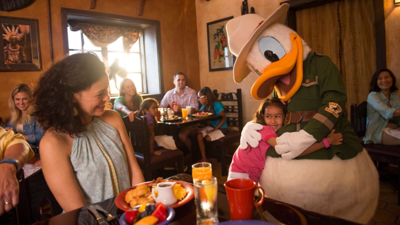 Donald Duck dressed in safari gear, greeting Guests at Tusker House Restaurant
