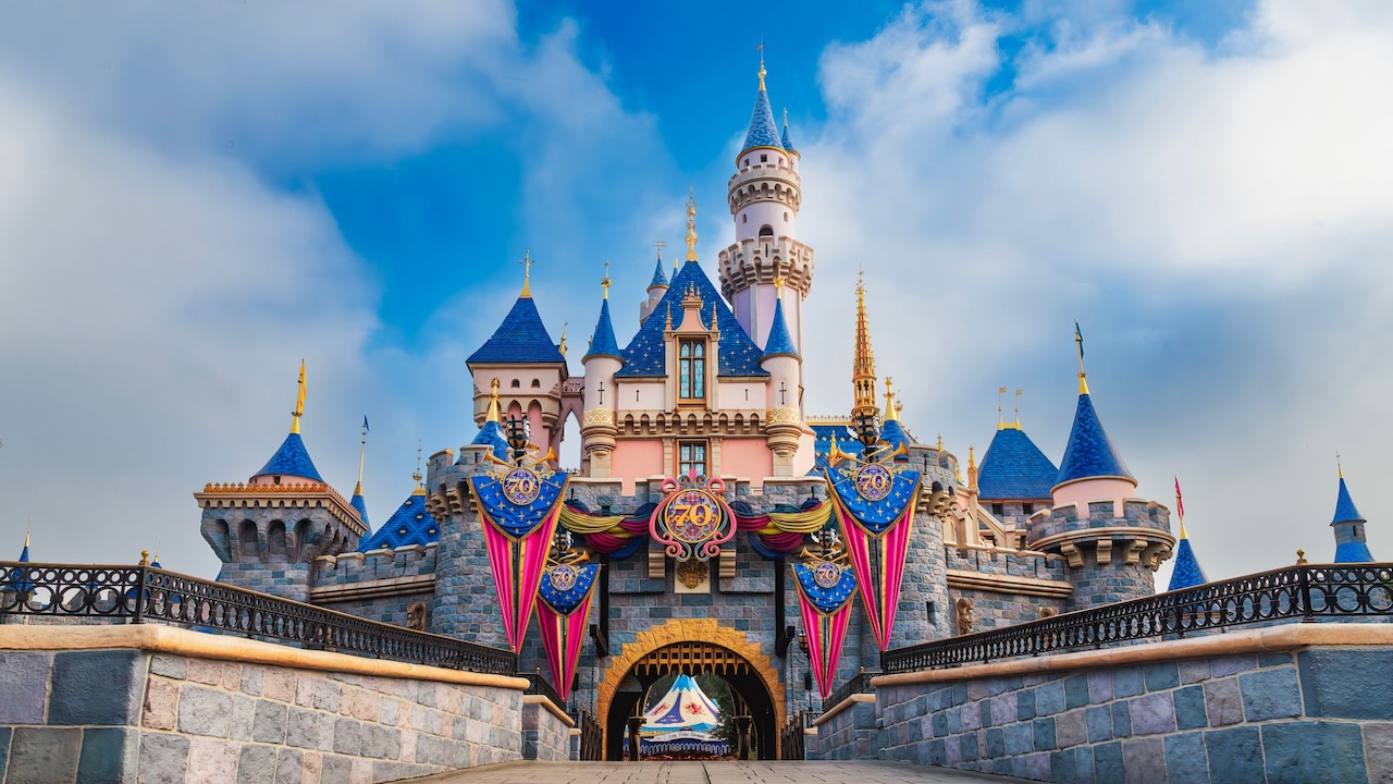 Exterior of Sleeping Beauty Castle at Disneyland park with Disneyland Resort 70th Celebration decorations