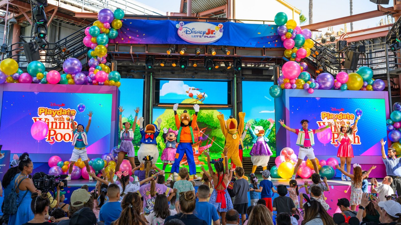 Mickey Mouse, Goofy, Pluto and Daisy performing on stage for a crowd of children during Disney Junior Let's Play 