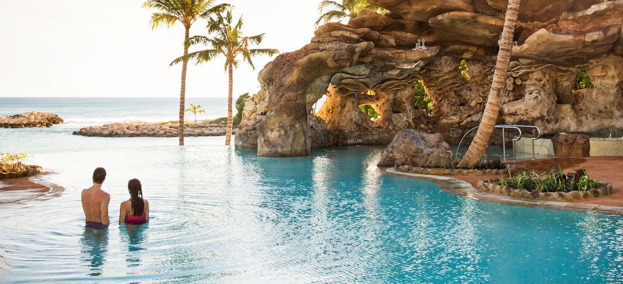 Beach Aulani Hawaii Resort Spa A Unwinds In The Waters Of Ka Maka Grotto Oceanfront Pool While Looking Out