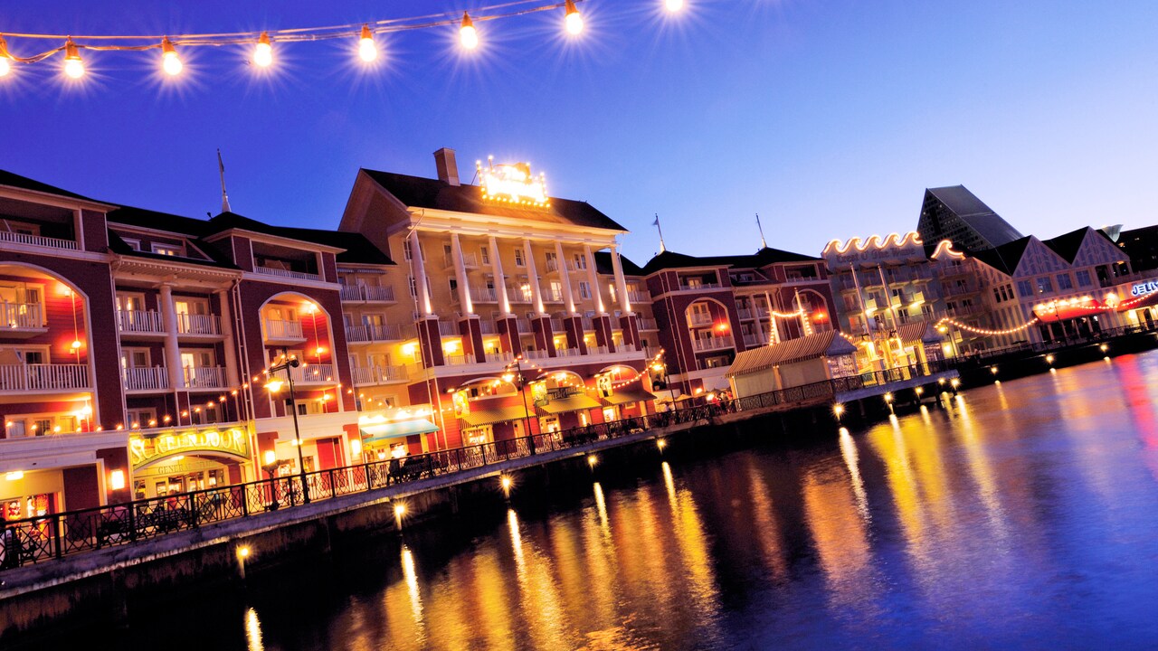 The Disney Boardwalk Inn shines brightly in the night sky