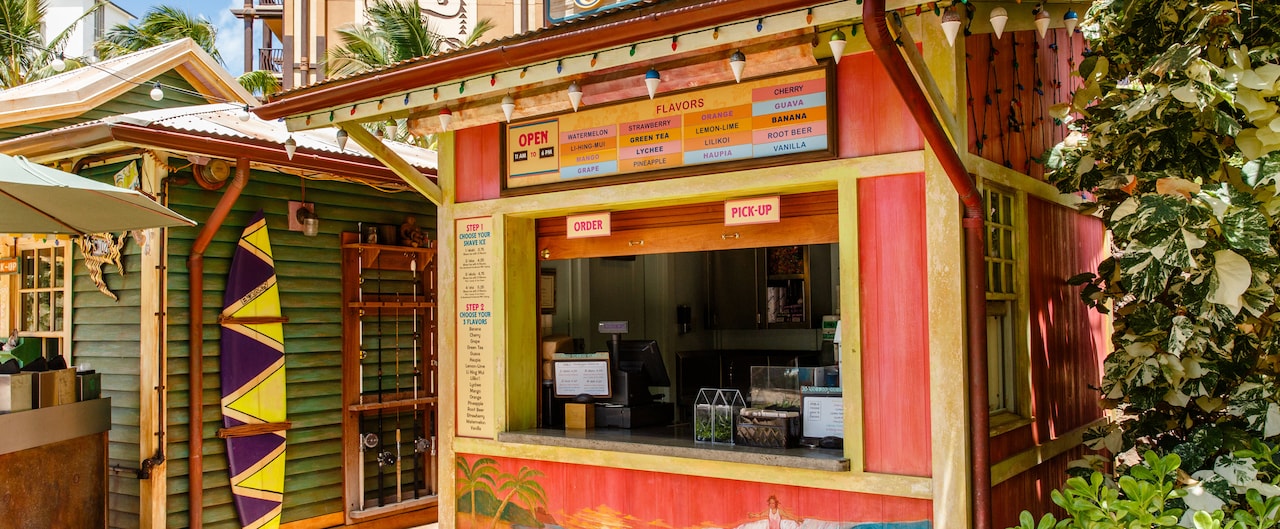 The exterior of Papalua Shave Ice, showing the menu board, ordering instructions and walk up window