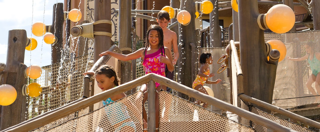 Kids of all ages laugh and play while they make their way across the Menehune Bridge play area