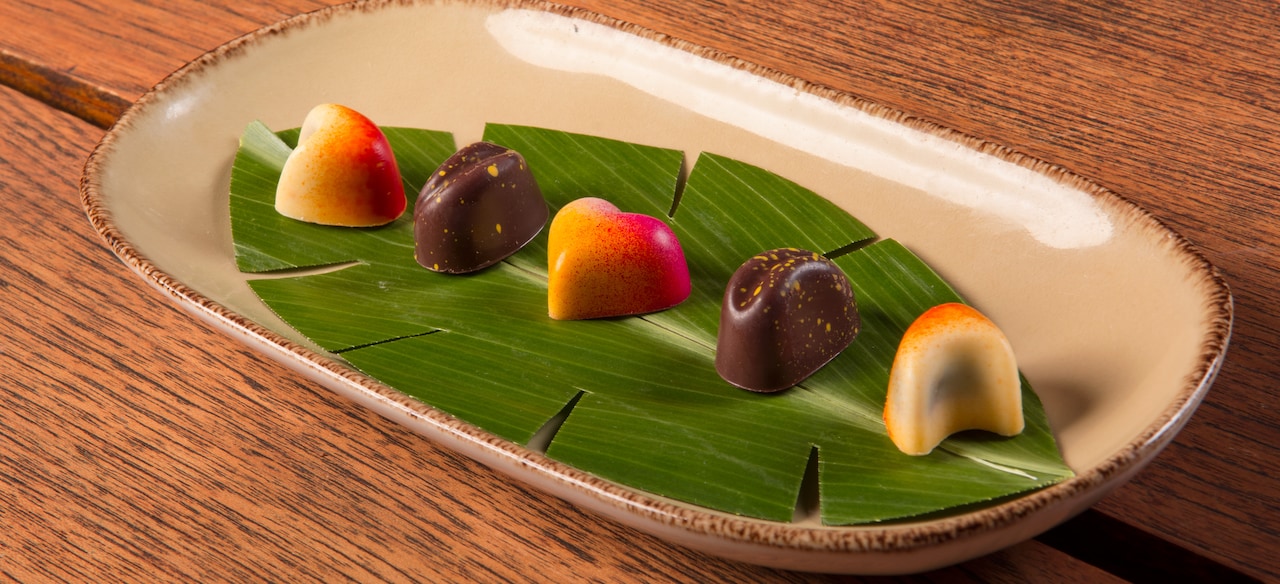 An elegant selection of candies is presented on a serving dish.