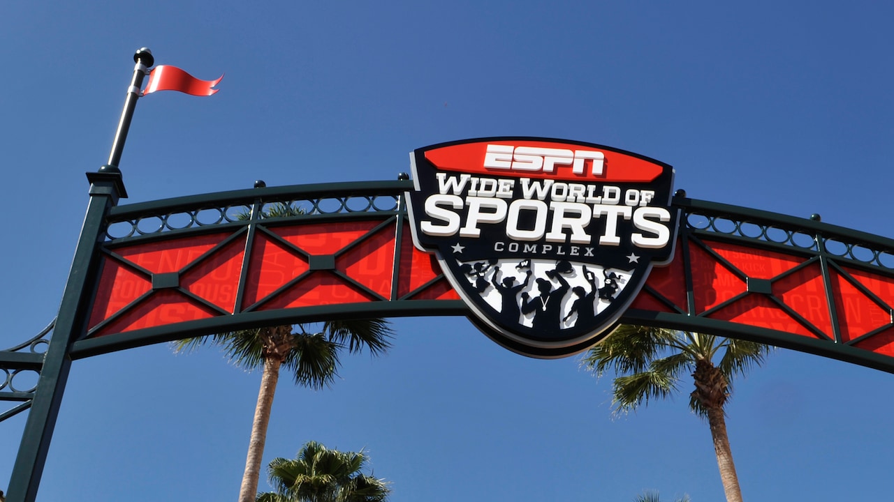 A large, overhead sign that reads E S P N Wide World of Sports Complex