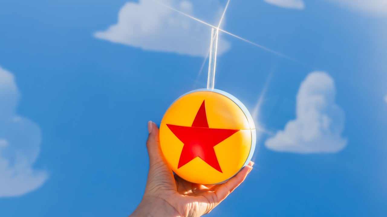 A Disney Parks Pixar Ball Cup with straw sipper