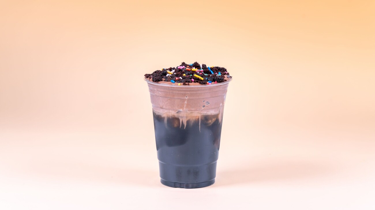 A chocolate cold brew drink topped with cookie crumbles and sprinkles, available during Bluey's Best Day Ever