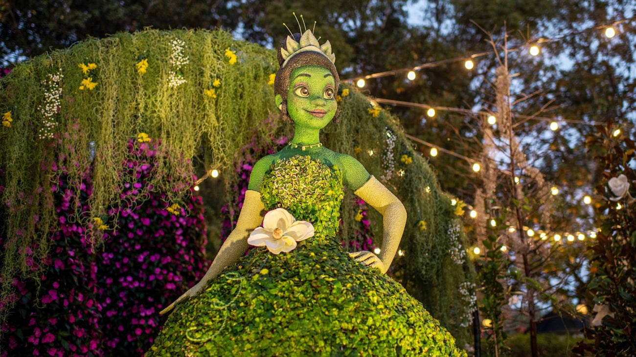 A topiary display depicting Princess Tiana from The Princess and the Frog