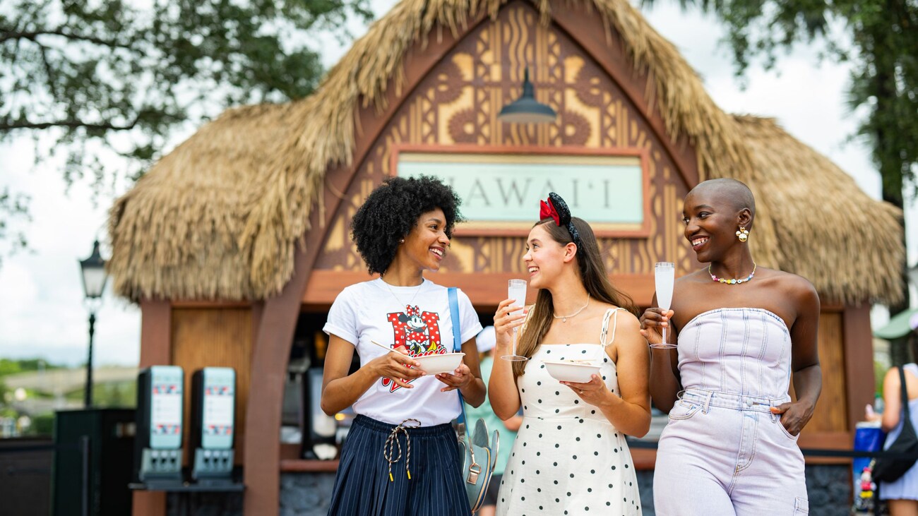 Three Guests enjoying food and drinks during the Epcot International Food & Wine Festival