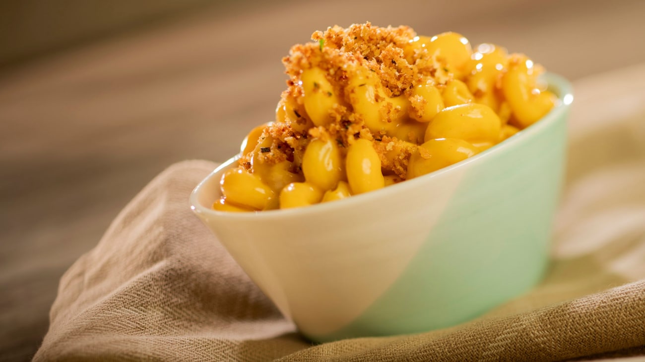 A bowl of Three Cheese Macaroni and Cheese topped with herbed panko and smoked cheddar sauce