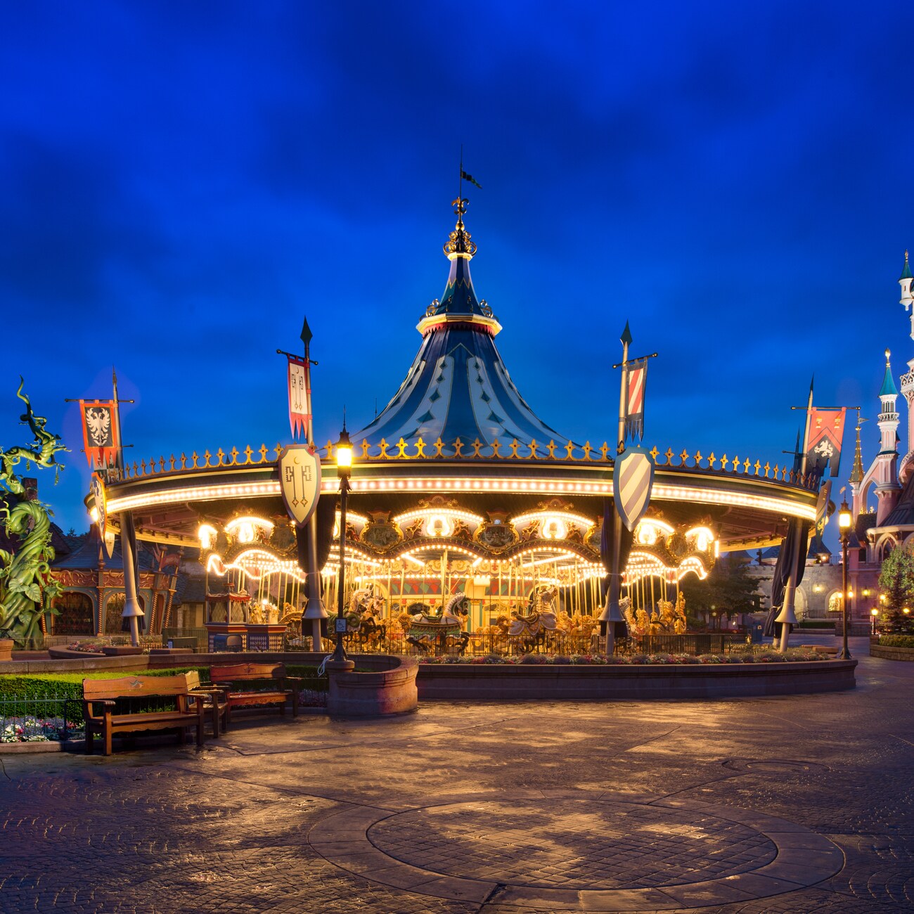 Rectangle-shaped topiary trees outside Sleeping Beauty Castle in Disneyland Park at Disneyland Paris